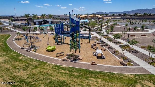 view of jungle gym with a mountain view