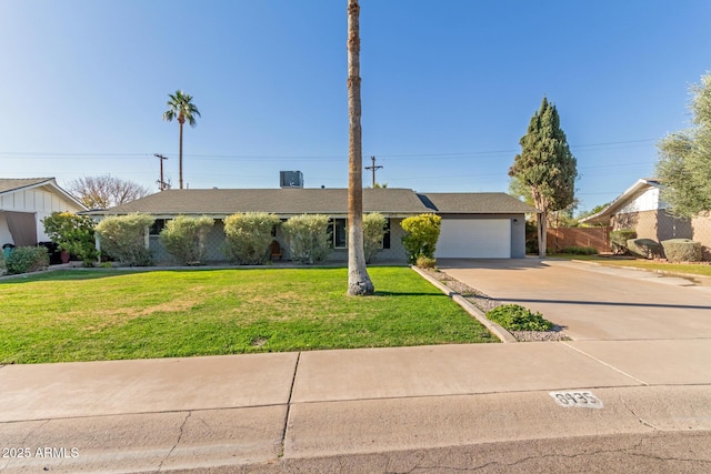 ranch-style house with a front yard and a garage