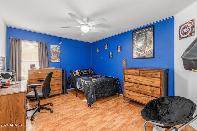 bedroom with ceiling fan and light hardwood / wood-style flooring