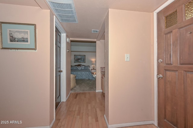 hall with light hardwood / wood-style flooring