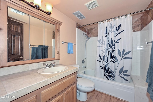 full bathroom featuring shower / bath combo with shower curtain, vanity, toilet, and wood-type flooring