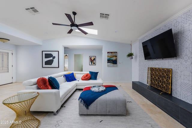 8338 E Monterosa St, Scottsdale, AZ 85251 - living area with visible vents, ceiling fan, vaulted ceiling with skylight, and baseboards