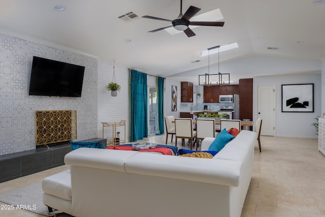 8338 E Monterosa St, Scottsdale, AZ 85251 - living area with wallpapered walls, an accent wall, visible vents, and ceiling fan