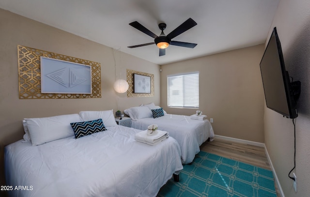 8338 E Monterosa St, Scottsdale, AZ 85251 - bedroom with wood finished floors, baseboards, and a ceiling fan