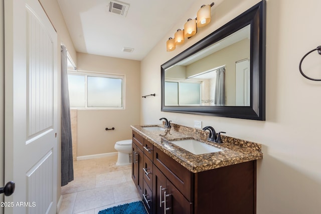 8338 E Monterosa St, Scottsdale, AZ 85251 - full bath with baseboards, double vanity, a sink, and visible vents