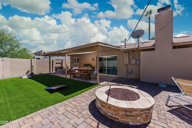 8338 E Monterosa St, Scottsdale, AZ 85251 - rear view of property featuring a yard, stucco siding, an outdoor fire pit, a patio, and fence