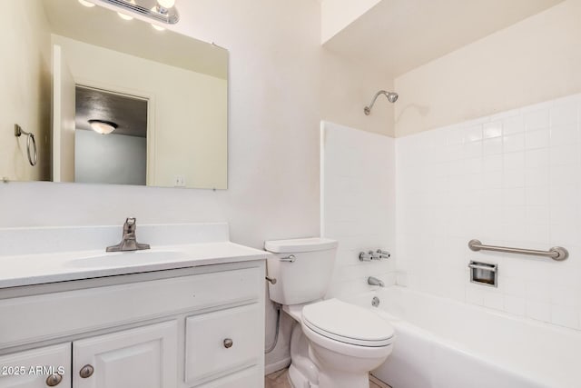 bathroom with toilet,  shower combination, and vanity