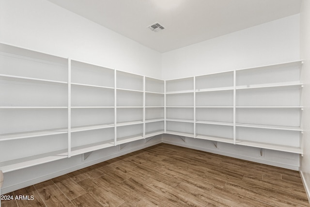 spare room featuring wood-type flooring