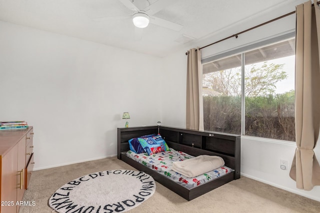 bedroom featuring carpet flooring, ceiling fan, and baseboards