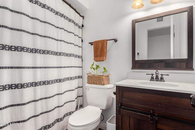 full bath with a shower with shower curtain, visible vents, toilet, and vanity