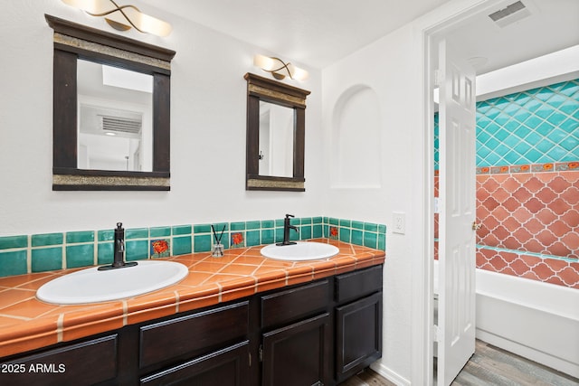 8844 S 51st St Unit 3, Phoenix, AZ 85044 - full bath featuring double vanity, visible vents, a sink, and wood finished floors