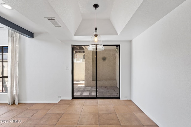 8844 S 51st St Unit 3, Phoenix, AZ 85044 - unfurnished room featuring visible vents, tile patterned flooring, a raised ceiling, and baseboards