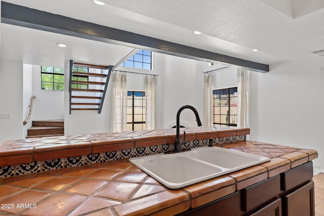 8844 S 51st St Unit 3, Phoenix, AZ 85044 - kitchen with tile countertops, recessed lighting, and a sink