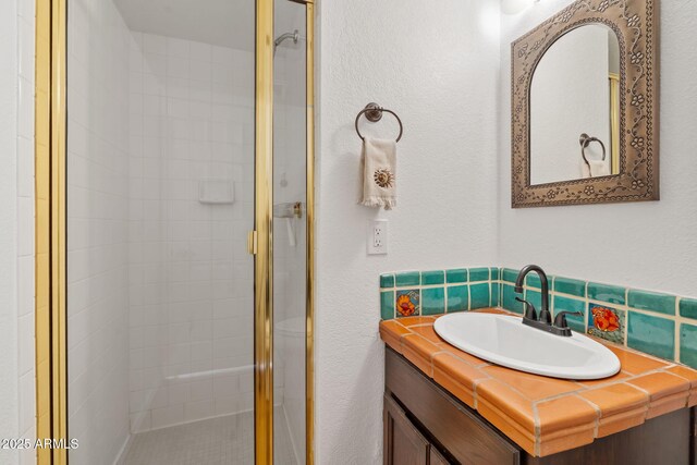 8844 S 51st St Unit 3, Phoenix, AZ 85044 - bathroom with vanity, a textured wall, and a shower stall