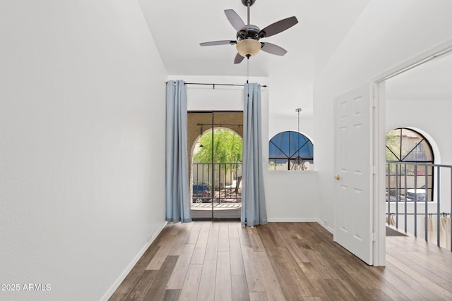 8844 S 51st St Unit 3, Phoenix, AZ 85044 - entryway with baseboards, ceiling fan, wood finished floors, and vaulted ceiling