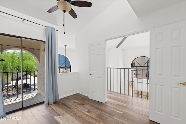 8844 S 51st St Unit 3, Phoenix, AZ 85044 - interior space featuring baseboards, a ceiling fan, a towering ceiling, and wood finished floors