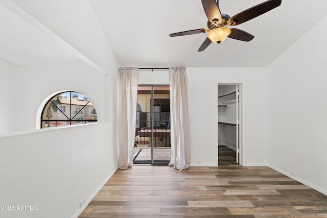 8844 S 51st St Unit 3, Phoenix, AZ 85044 - unfurnished bedroom featuring ceiling fan, baseboards, access to outside, and wood finished floors