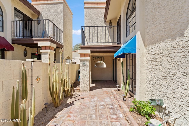 8844 S 51st St Unit 3, Phoenix, AZ 85044 - view of side of home featuring fence, a balcony, and stucco siding