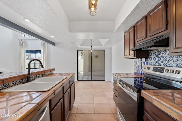 8844 S 51st St Unit 3, Phoenix, AZ 85044 - kitchen with a sink, under cabinet range hood, tile countertops, and stainless steel range with electric cooktop