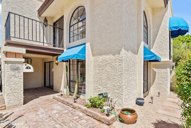 8844 S 51st St Unit 3, Phoenix, AZ 85044 - view of side of property featuring stucco siding and a balcony