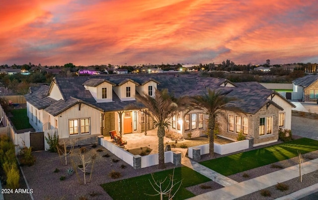 view of front of home with a yard