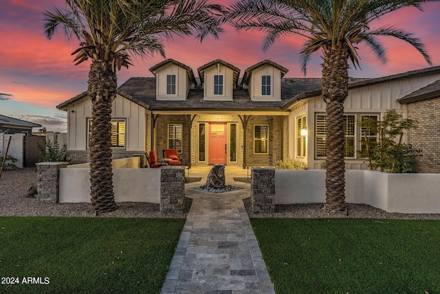 view of front of house with a yard