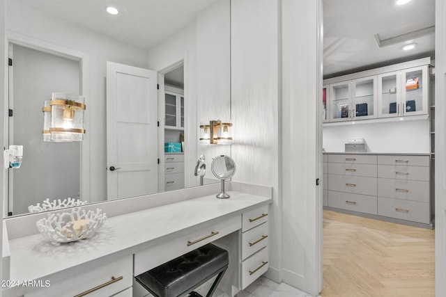 bathroom featuring recessed lighting and vanity