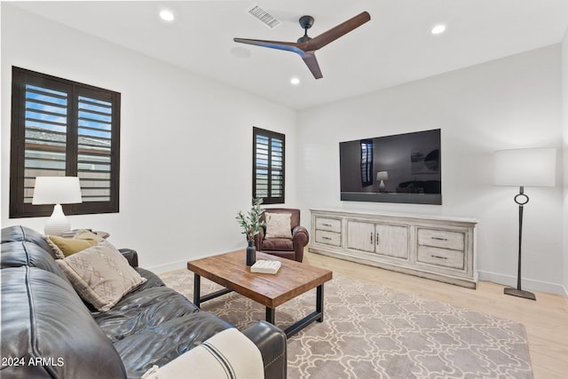 living area featuring light wood finished floors, visible vents, baseboards, ceiling fan, and recessed lighting