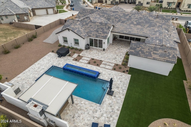 view of pool featuring a fenced in pool, a fenced backyard, a patio, and a lawn