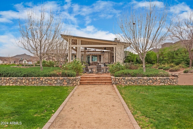 doorway to property featuring a lawn