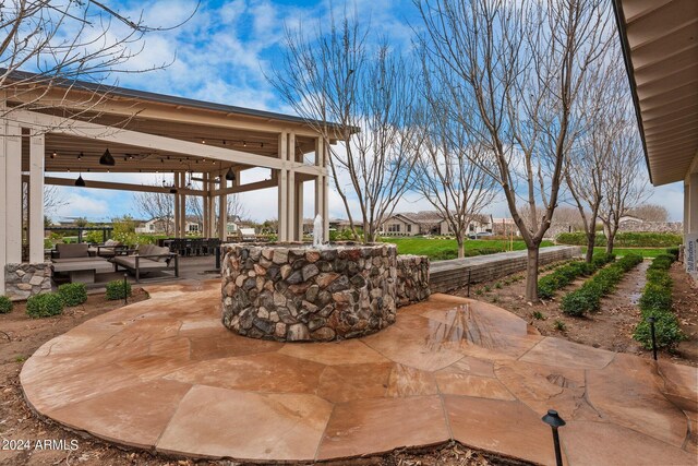 view of patio / terrace featuring an outdoor living space and a gazebo