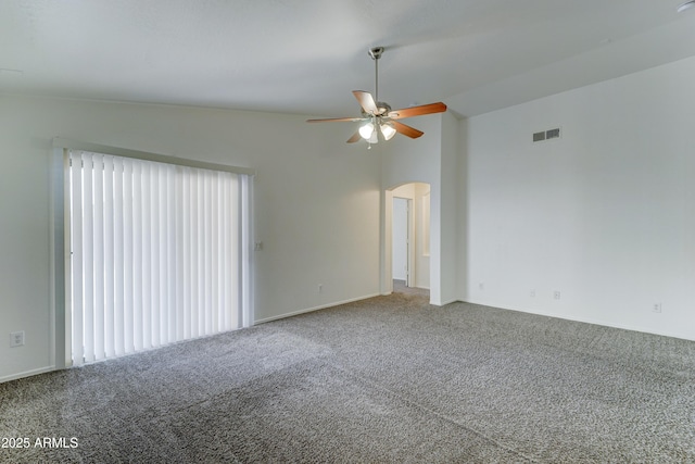 unfurnished room with visible vents, ceiling fan, carpet, arched walkways, and high vaulted ceiling