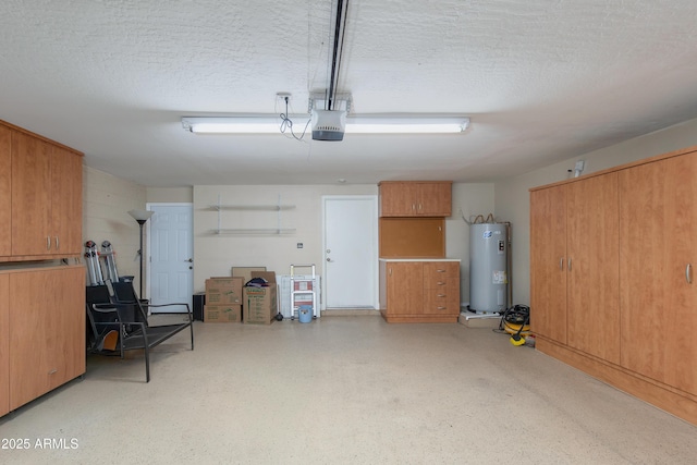 garage featuring electric water heater and a garage door opener
