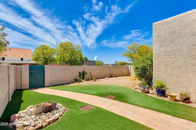 view of yard with a gate