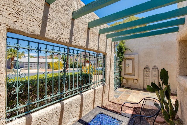 balcony featuring a pergola