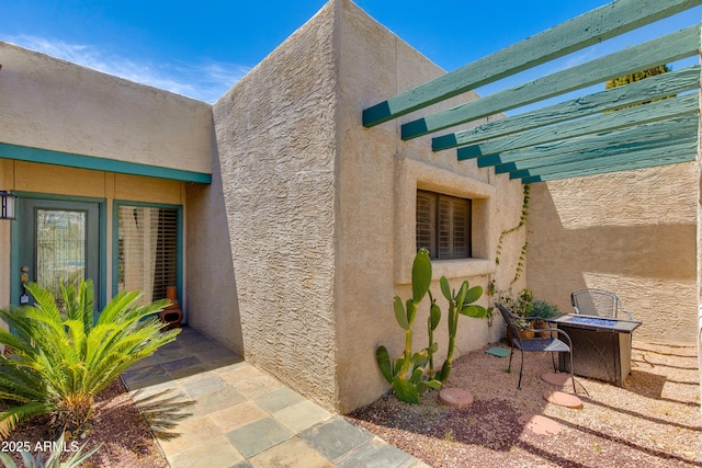 view of side of property with stucco siding