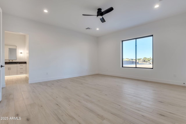 unfurnished room with visible vents, baseboards, a ceiling fan, light wood-style flooring, and recessed lighting