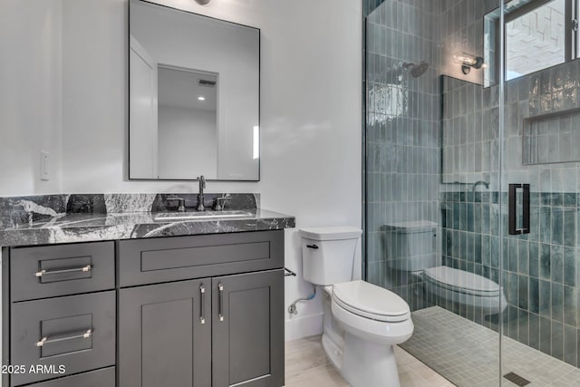 full bath with toilet, a shower stall, and vanity