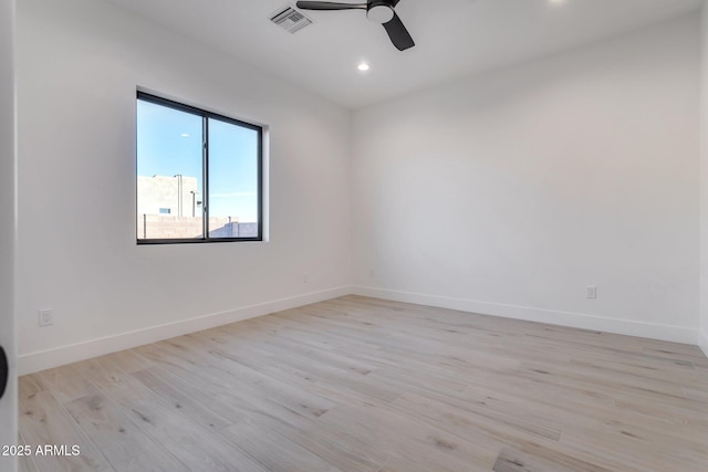 spare room with recessed lighting, visible vents, ceiling fan, light wood-type flooring, and baseboards