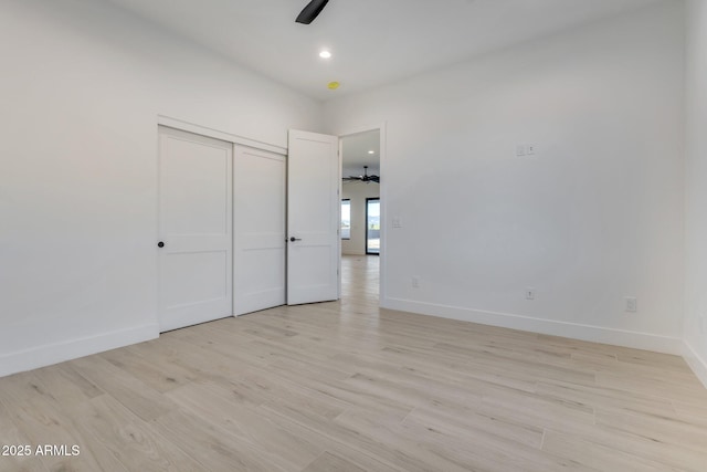 empty room featuring light wood-type flooring, ceiling fan, baseboards, and recessed lighting