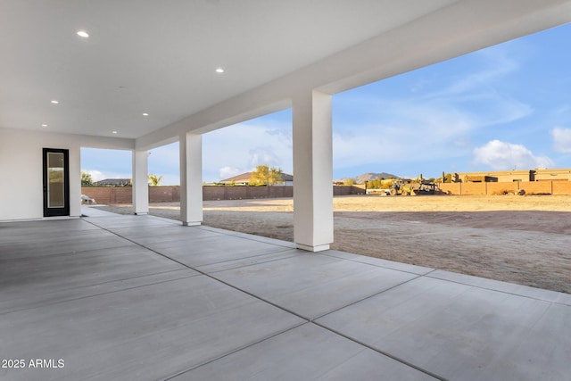 view of patio featuring fence