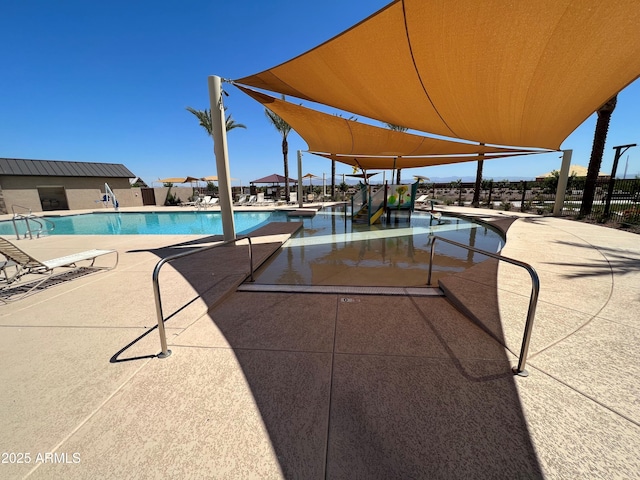 view of swimming pool with a patio area