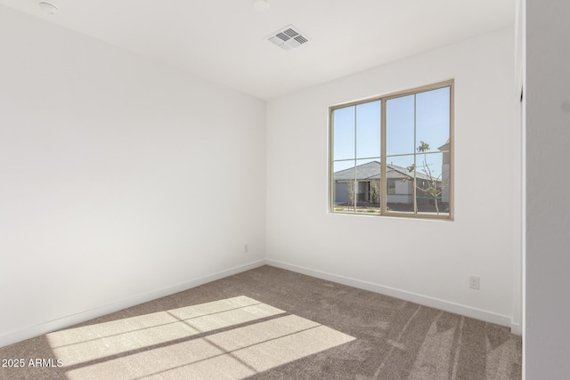 unfurnished room with carpet flooring