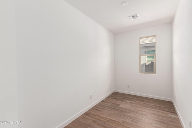 unfurnished room with light hardwood / wood-style floors