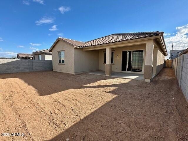 back of property featuring a patio area