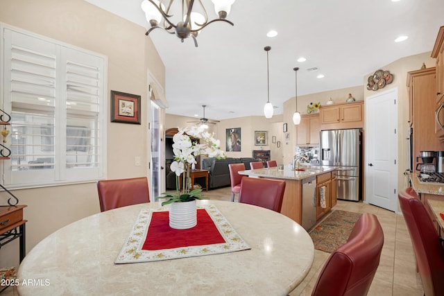 dining space featuring ceiling fan with notable chandelier, light tile patterned floors, visible vents, and recessed lighting