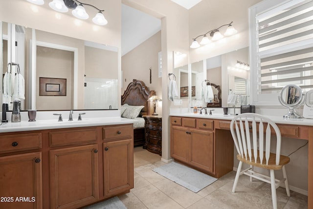 full bath with two vanities, a sink, and tile patterned floors