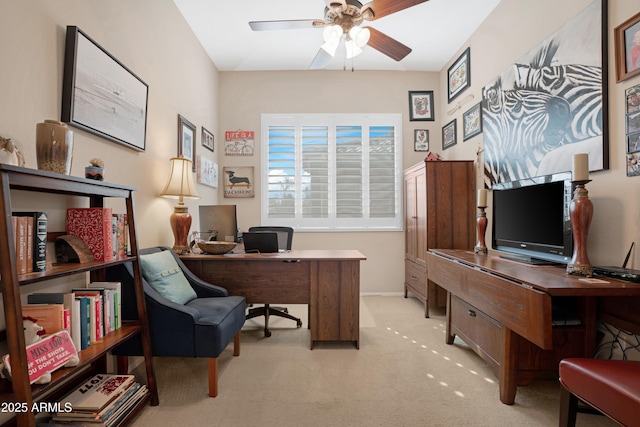 office area with a ceiling fan and light colored carpet