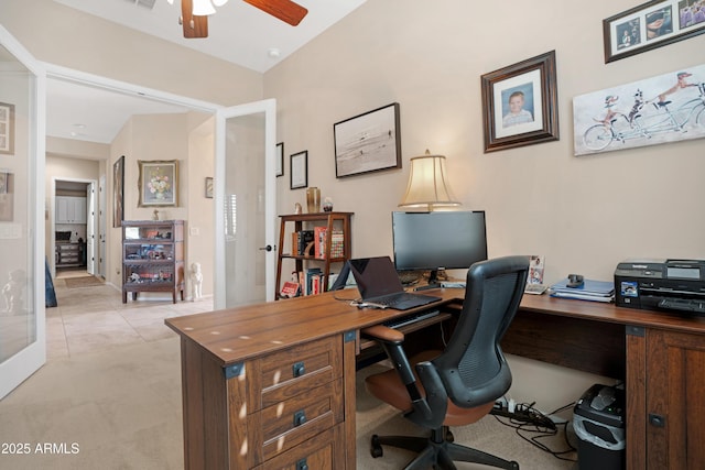 office area with ceiling fan, light tile patterned flooring, visible vents, and light colored carpet