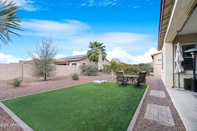 view of yard with a fenced backyard and a patio